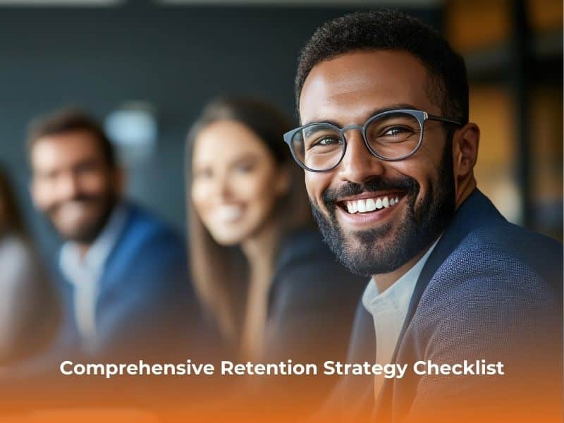 Smiling professional in a team setting during a workplace discussion.