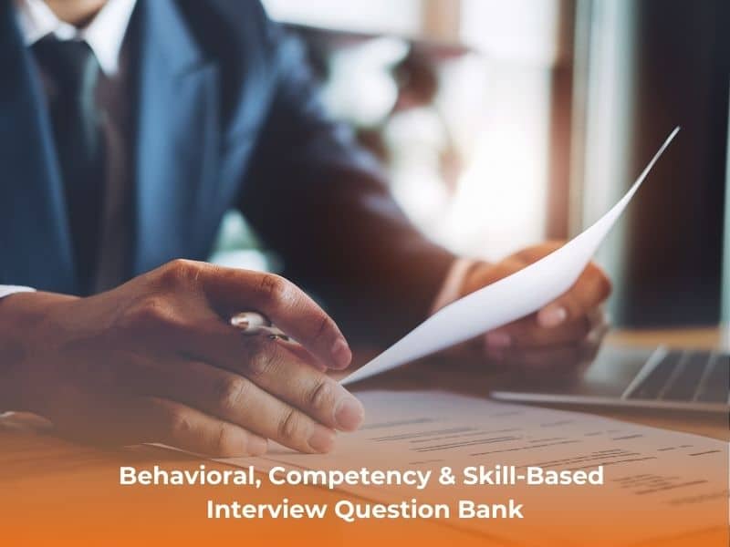 Interviewer reviewing documents and notes during a structured interview.