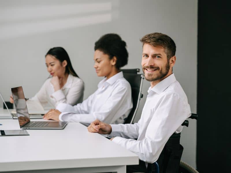 Team members working together at a conference table during a focused work session