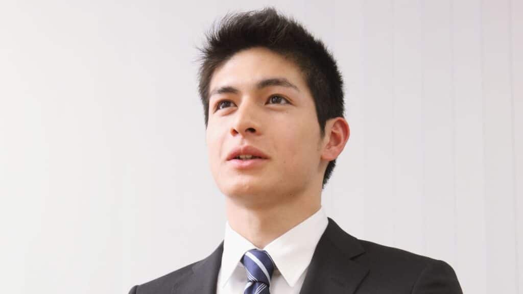 A male business professional.