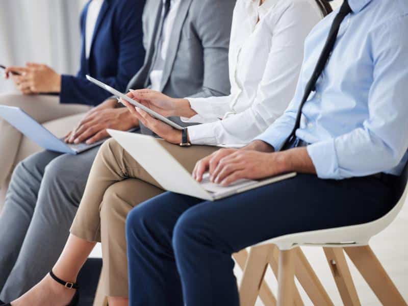 Executive candidates waiting during leadership hiring process interview