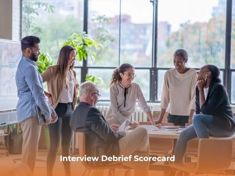 Team conducting interview debrief as part of a structured hiring process
