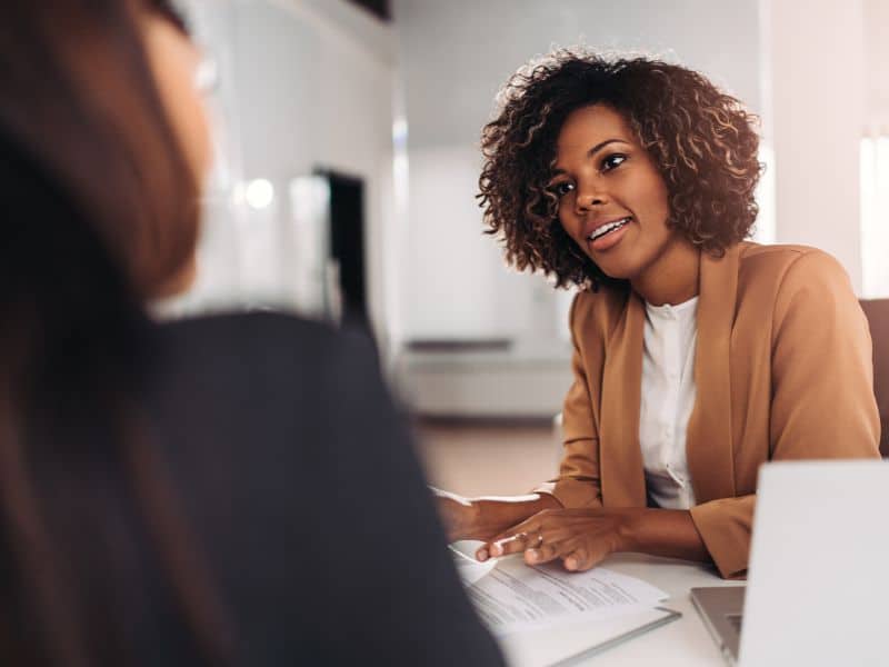 An interviewer utilizes interview techniques while working with a candidate.