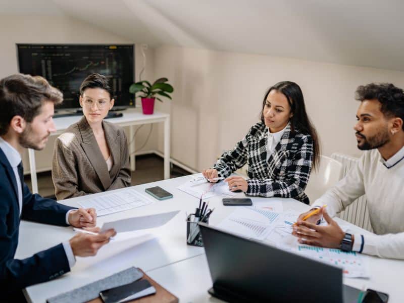 A hiring manager leads a discussion about hiring decision ownership with the hiring team.